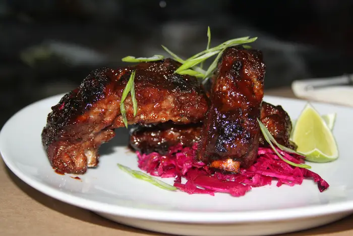 Guava and Chile Pequin-Glazed Ribs with Red Cabbage Escabeche, $14